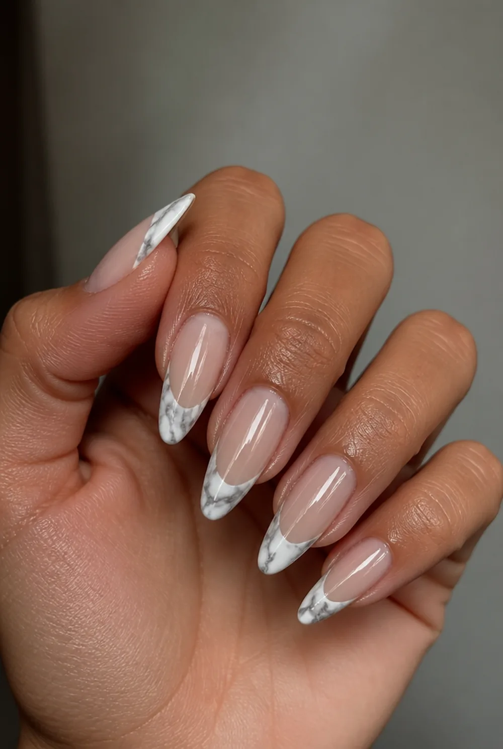 marble french tip nail art on olive skin, long length