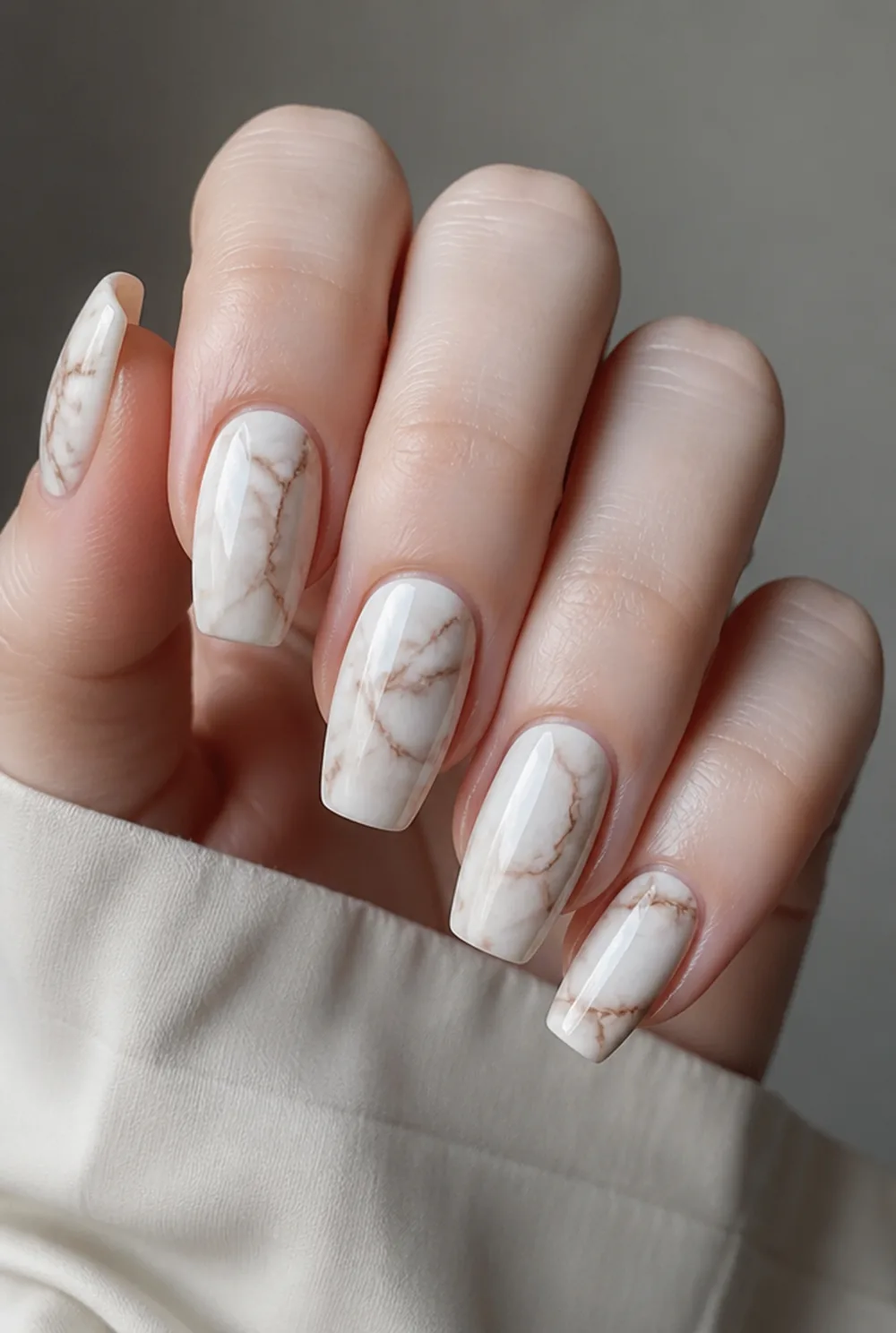 long coffin marble nail art on fair skin, short length