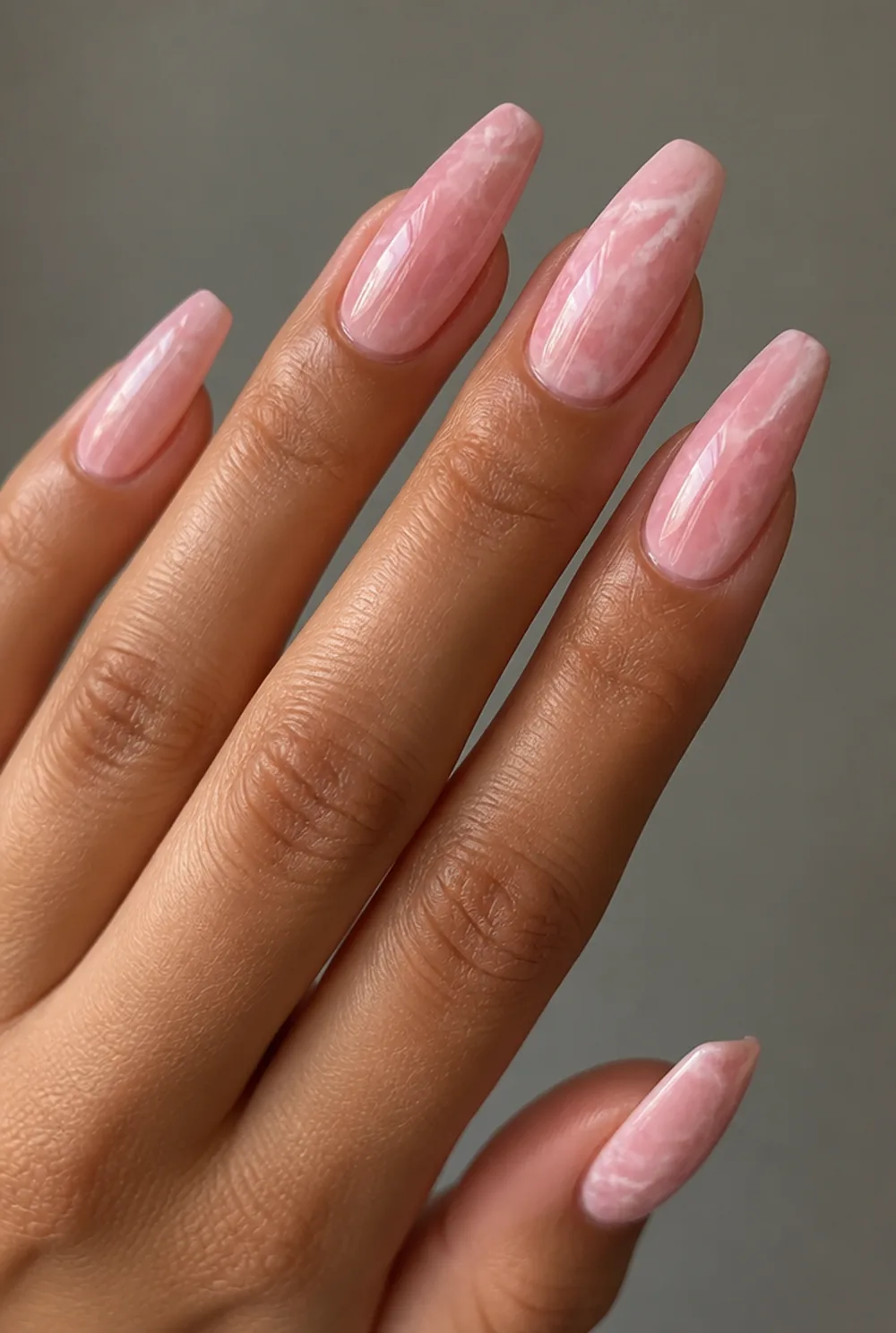 pink rosa marble nail art on olive skin, long length