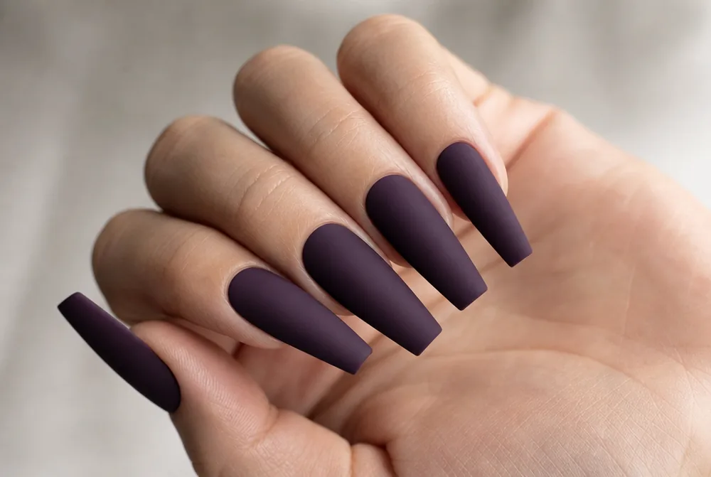 matte long coffin nails in a deep shade
