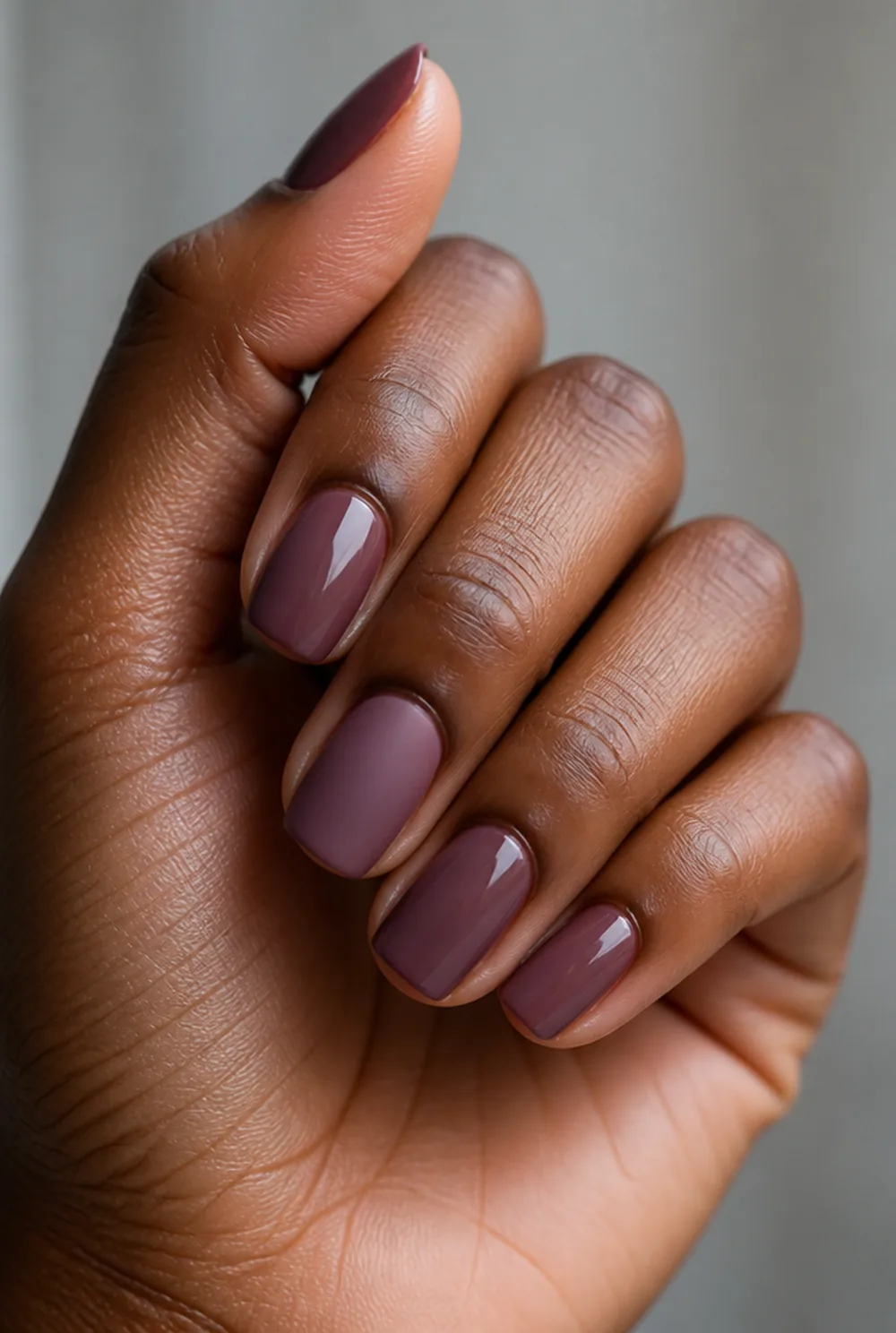 matte and glossy alternating nail art on deep brown skin