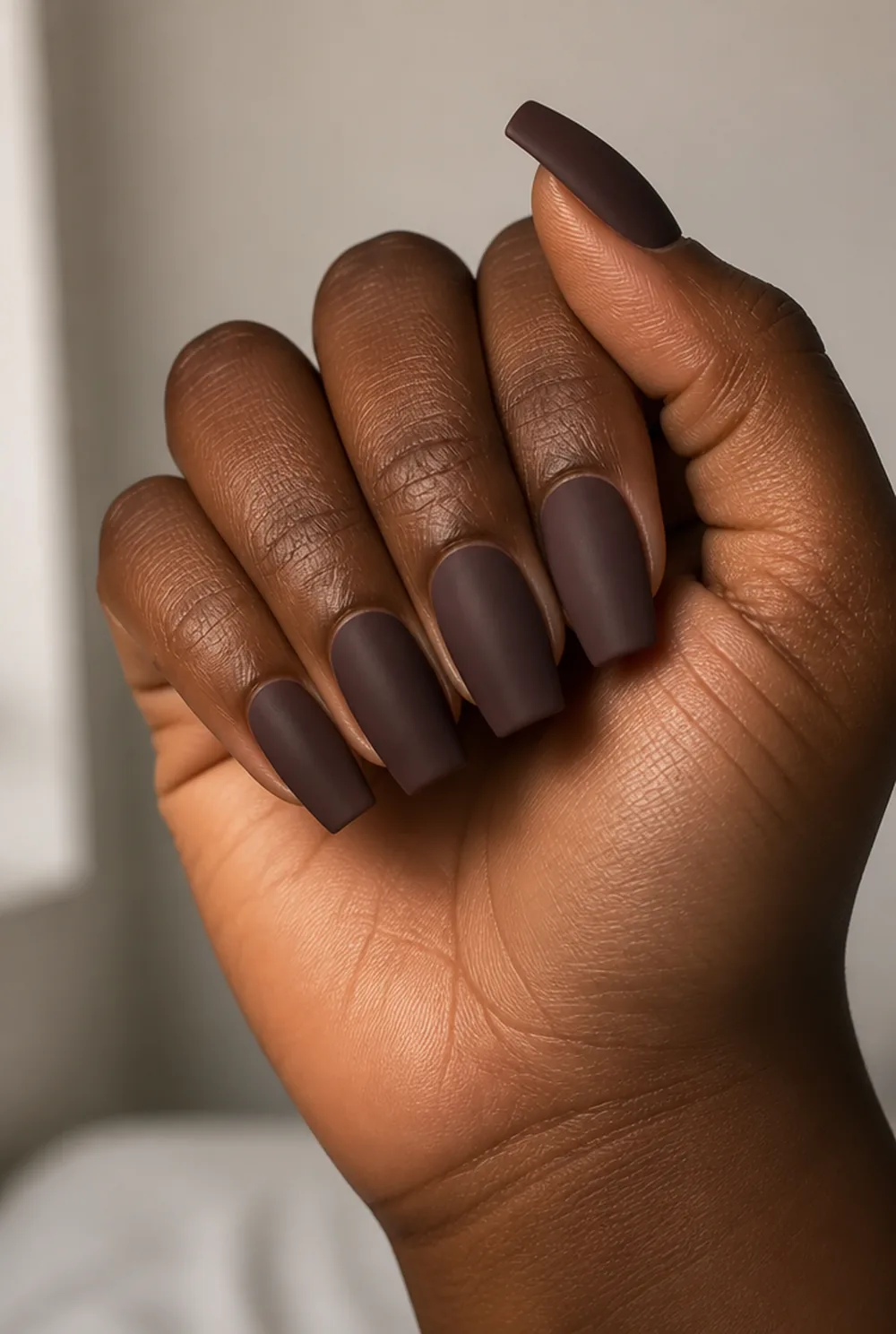 matte long coffin nail art on deep brown skin