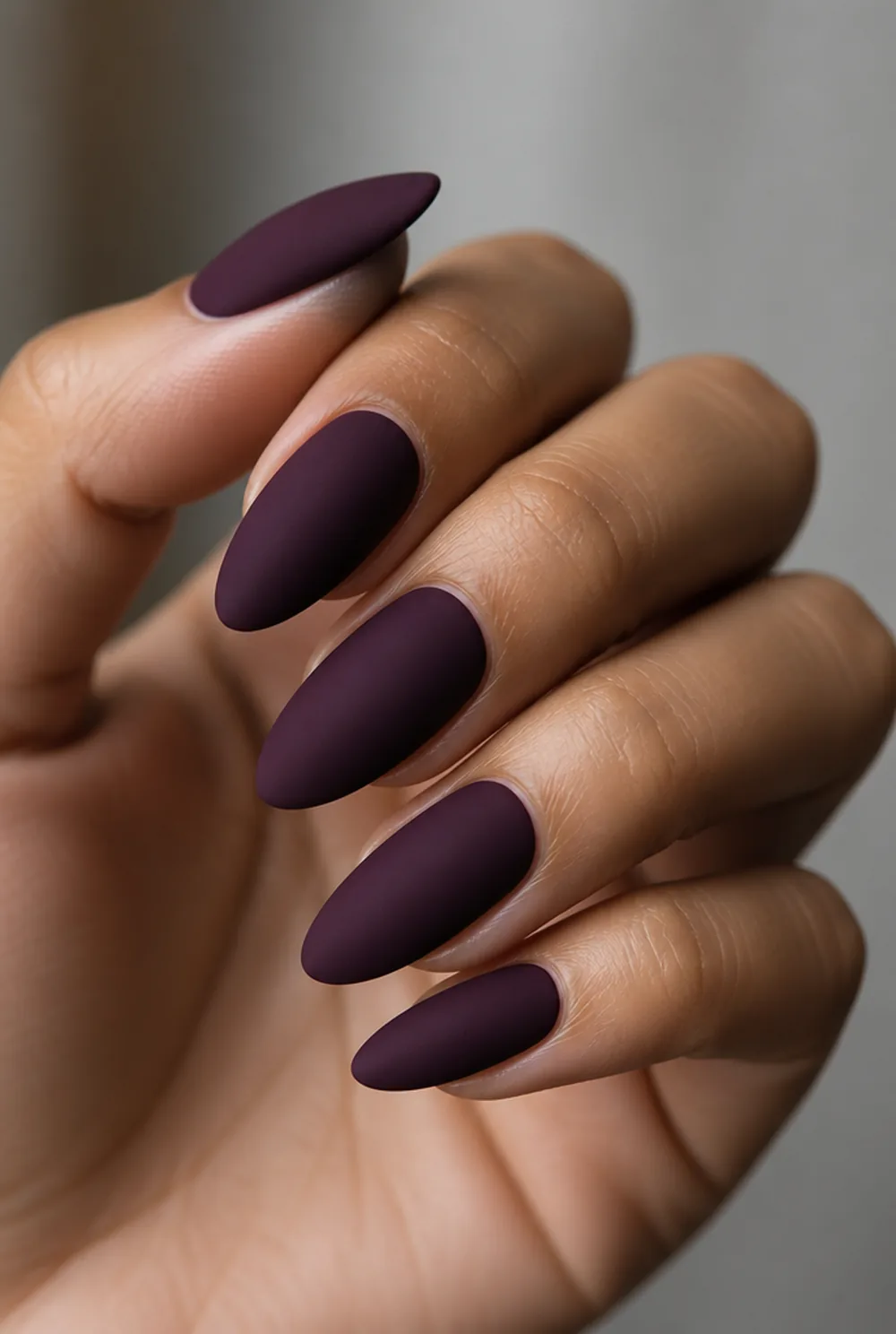 matte plum nail art on olive skin, long length