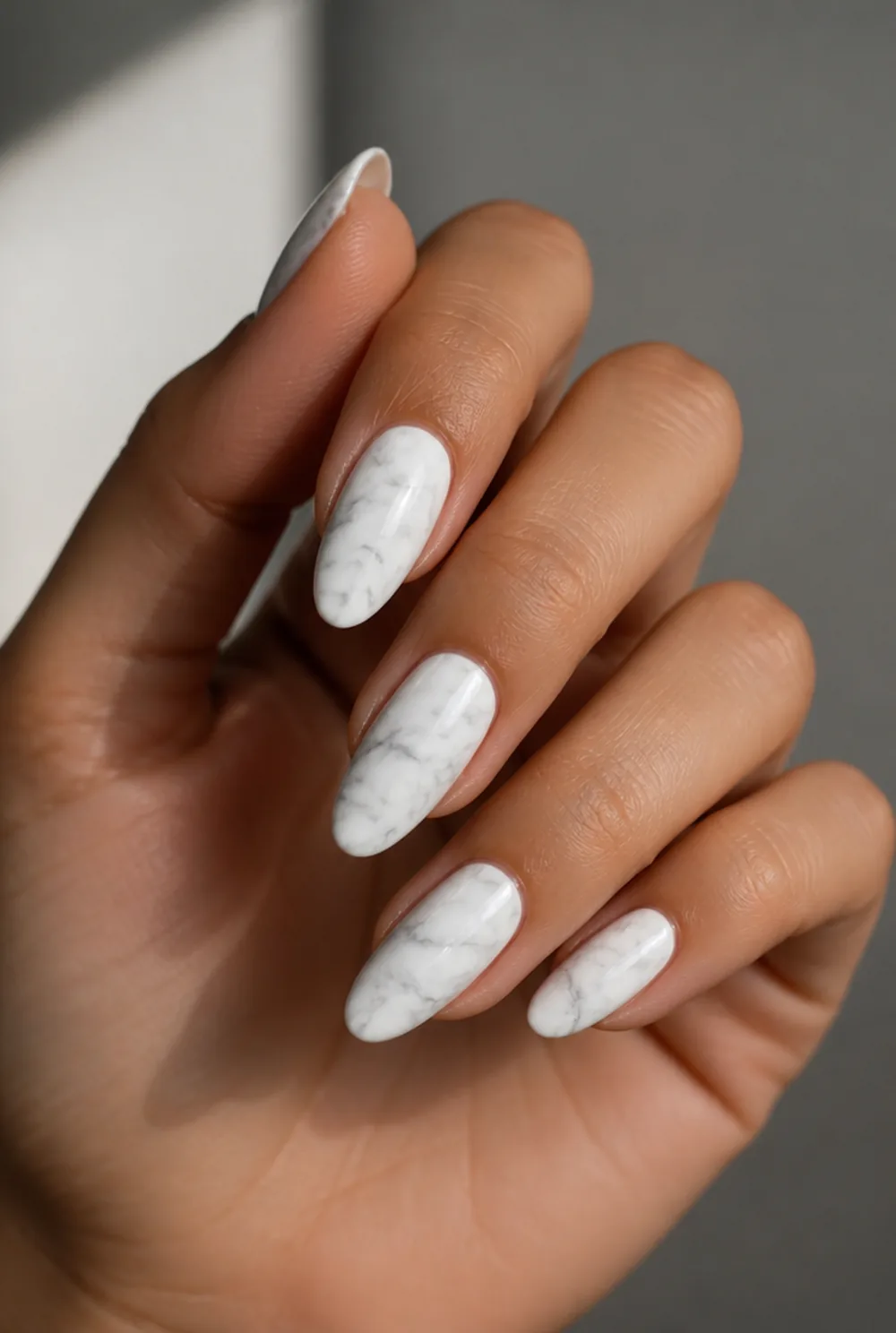 medium marble nail art on olive skin, long length