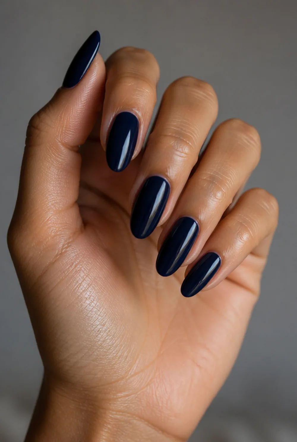medium navy nail art on olive skin, long length