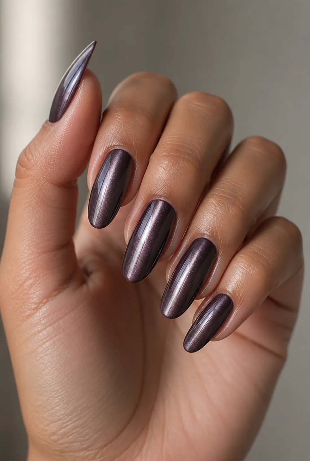 medium cat eye nail art on olive skin, long length