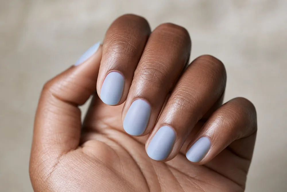 milky pale blue nails with soft diffused finish