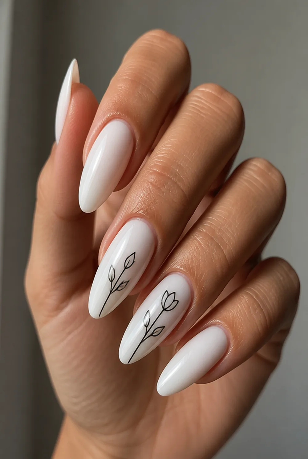milky with black line art nail art on olive skin, long length