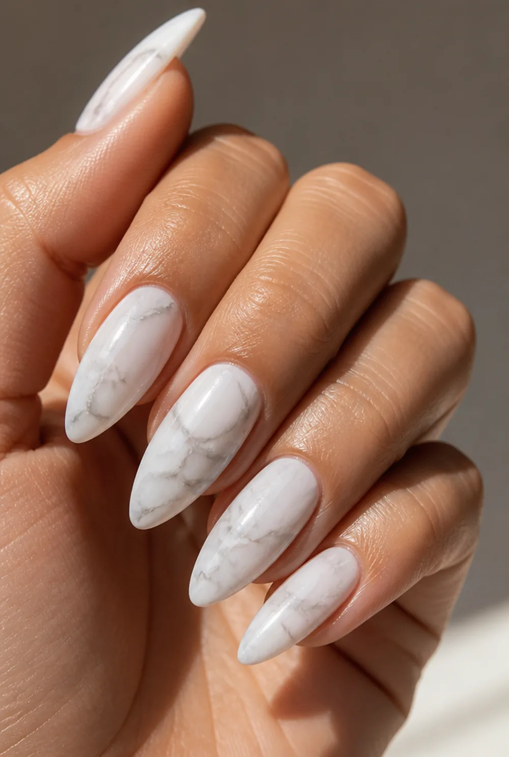 milky marble nail art on olive skin, long length
