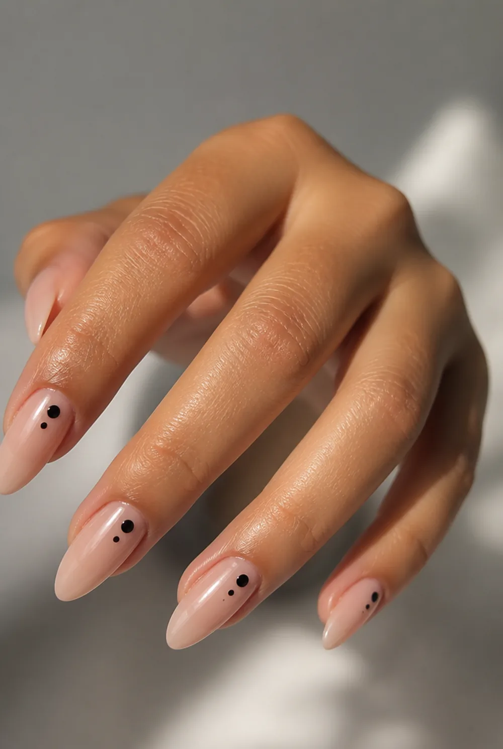 two-dot cluster nail art on olive skin, long length