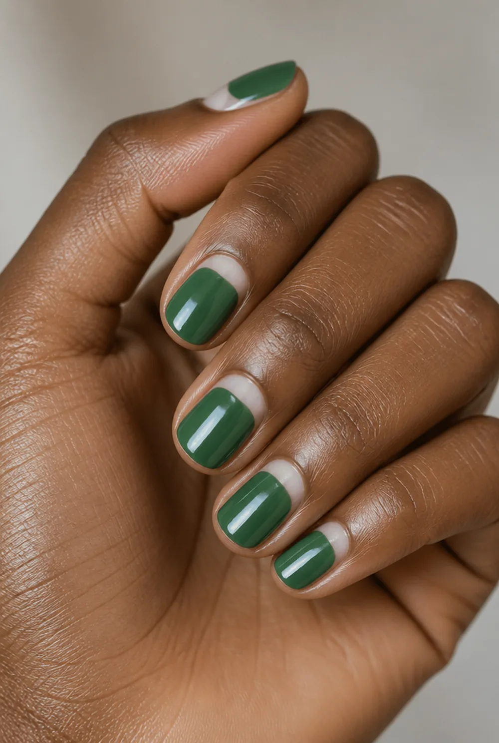half moon negative nail art on deep brown skin