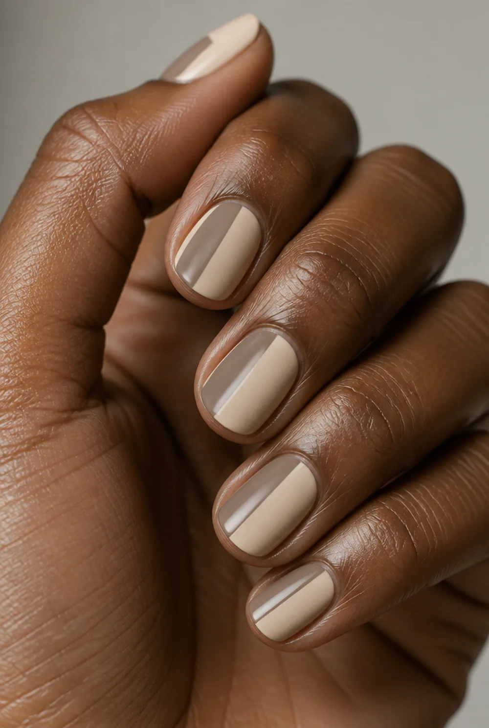 two-tone split nail art on deep brown skin