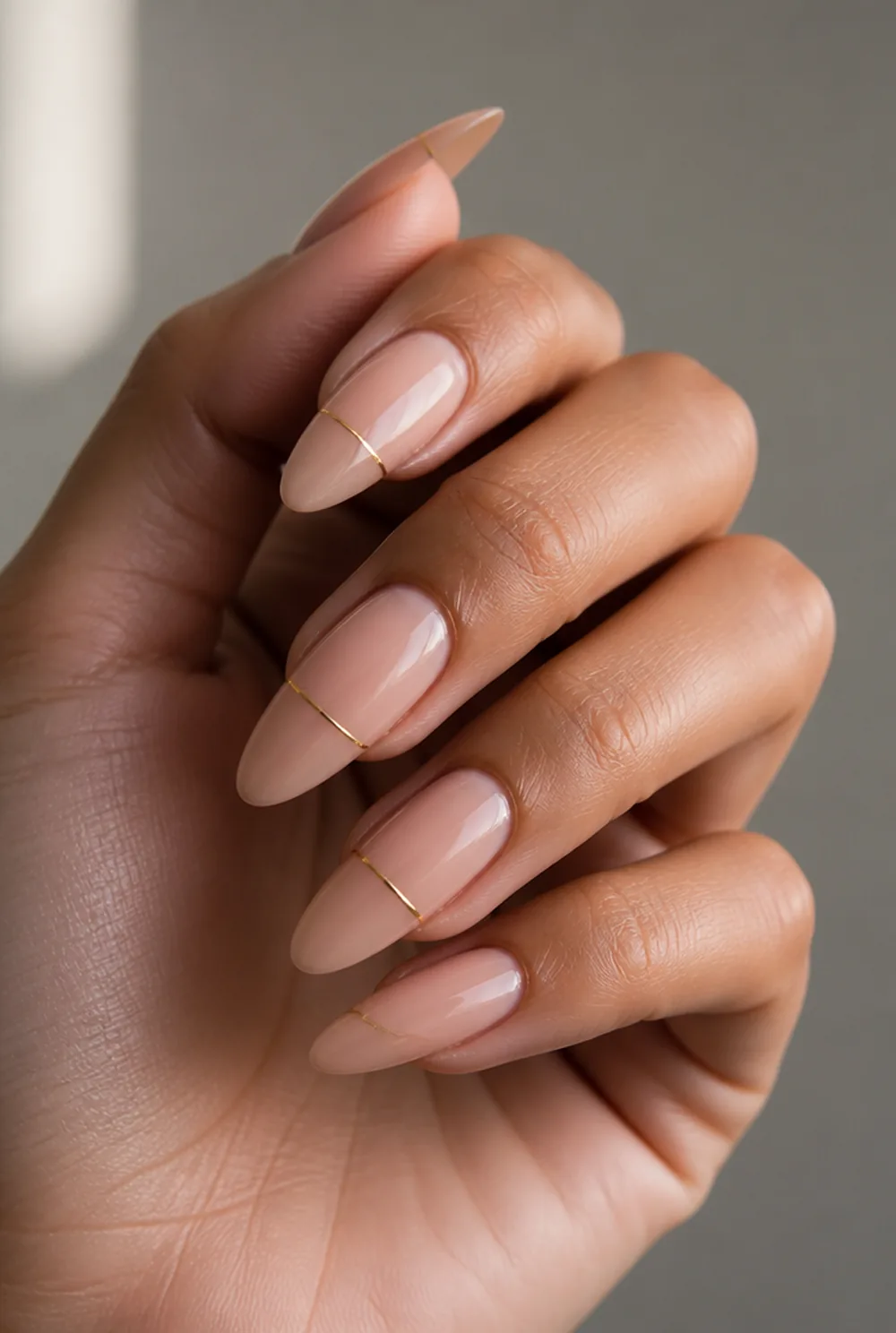 single gold line nail art on olive skin, long length