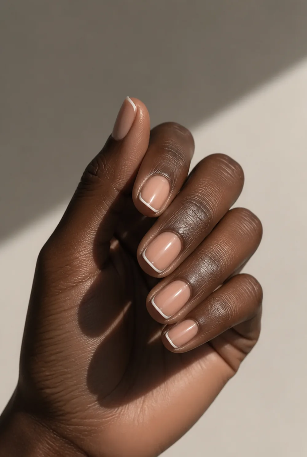 outline french nail art on deep brown skin
