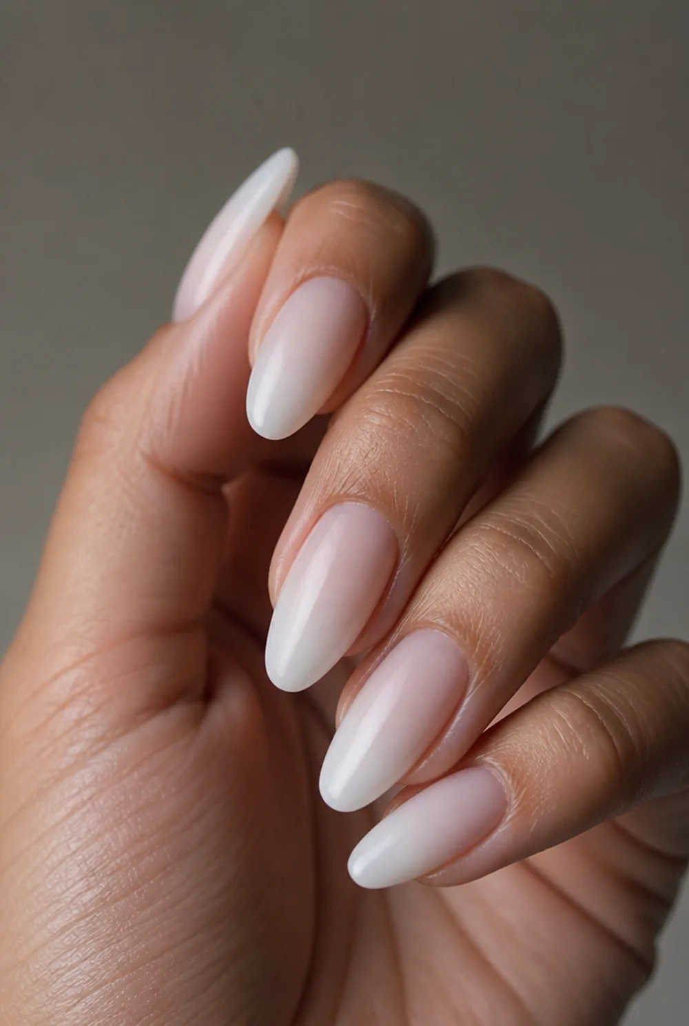 milky wash nail art on olive skin, long length