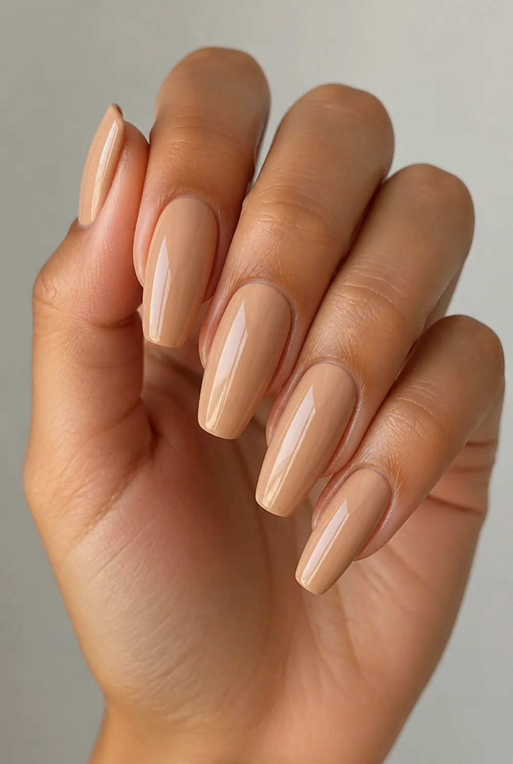 matched nude nail art on olive skin, long length
