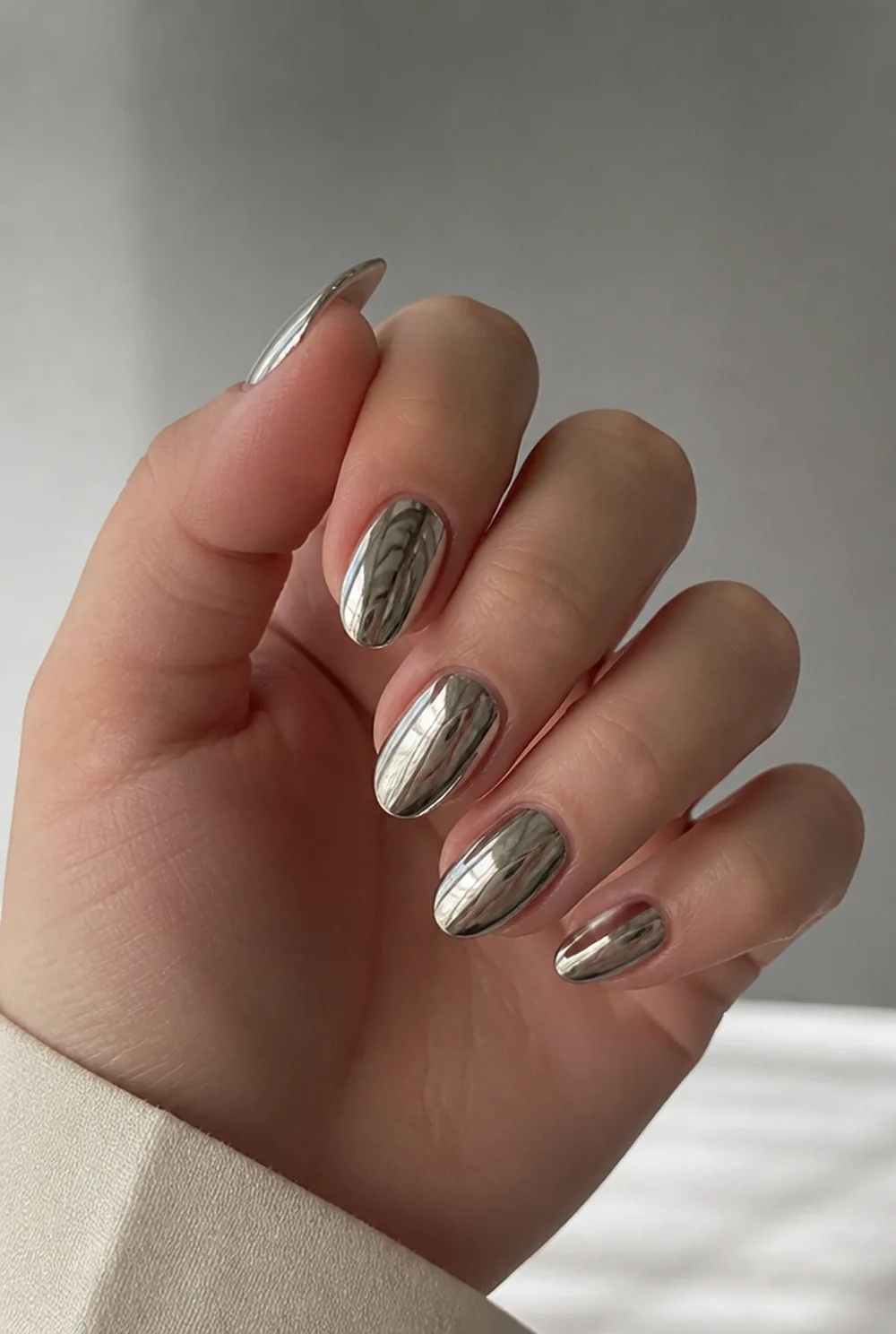 silver mirror chrome nail art on fair skin short length - PolishedAndPrettyNails.com silver mirror chrome nail art on fair skin, short length
