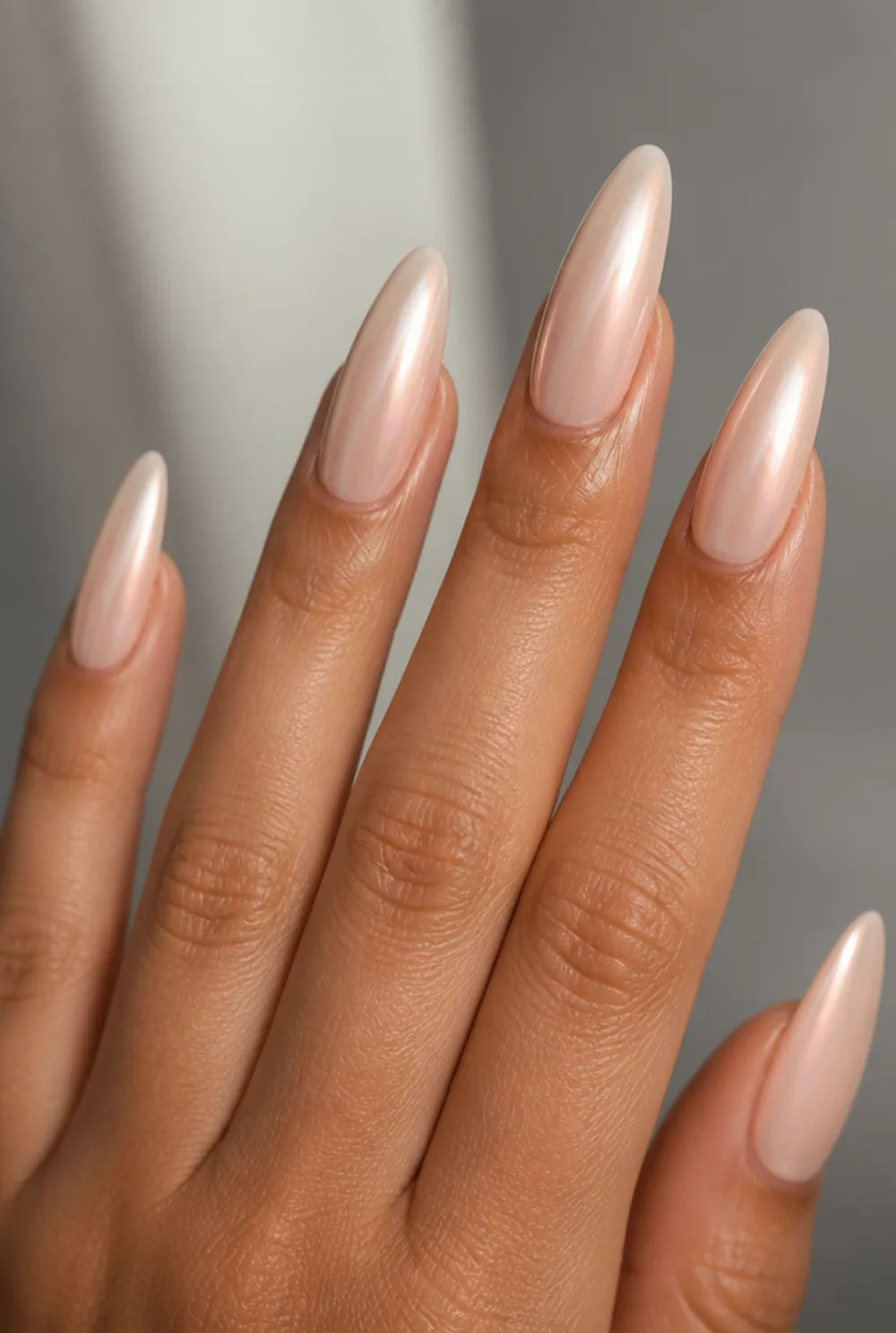 nude glazed donut nail art on olive skin, long length