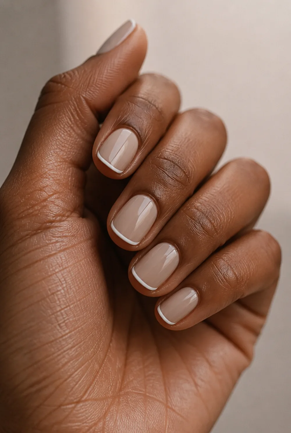 nude micro french nail art on deep brown skin