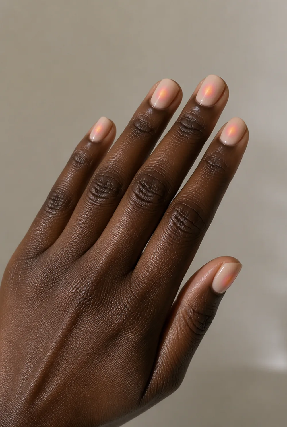 nude aura nail art on deep brown skin