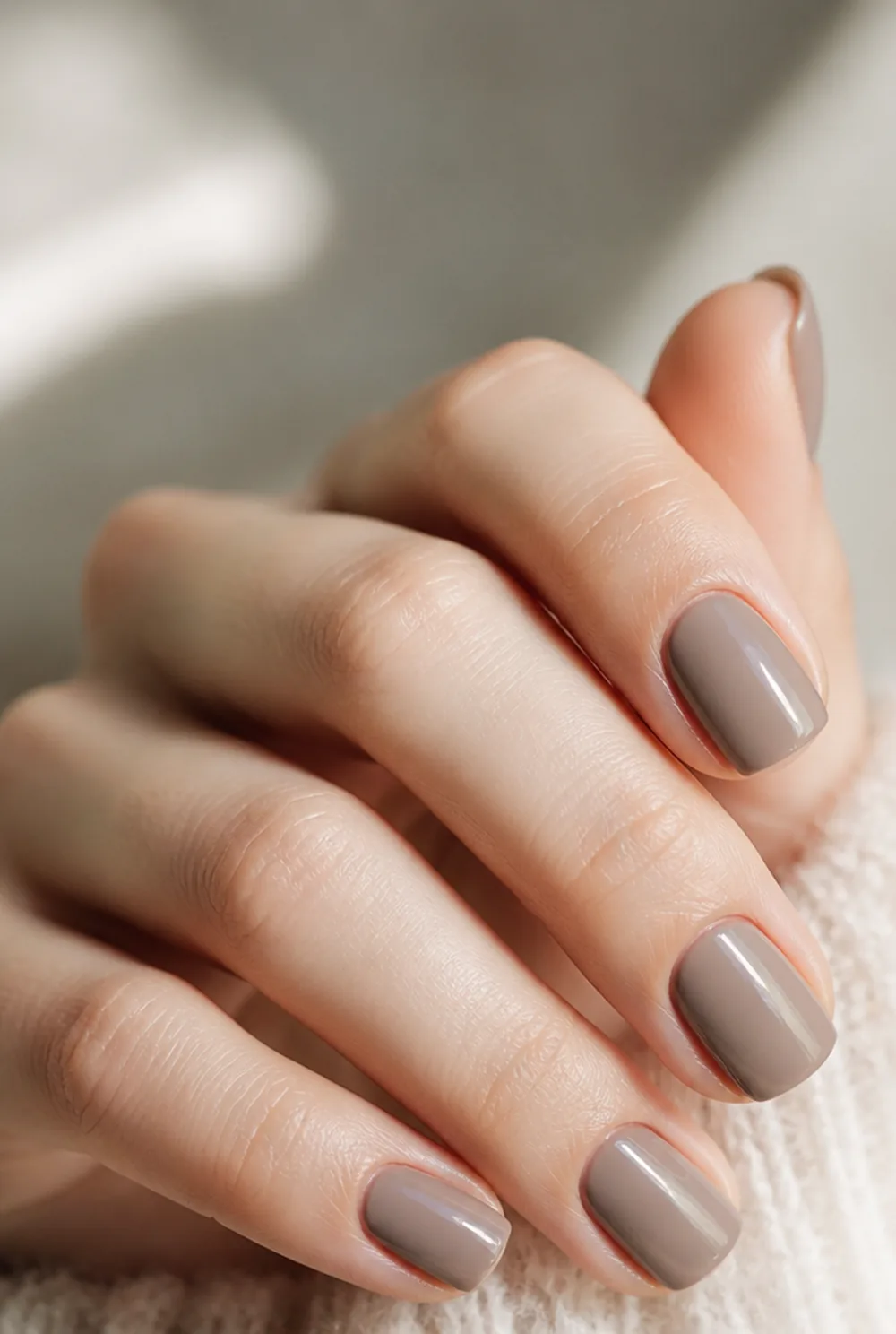 taupe nude nail art on fair skin, short length