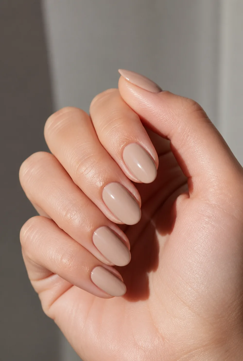 cashmere beige nail art on fair skin, short length