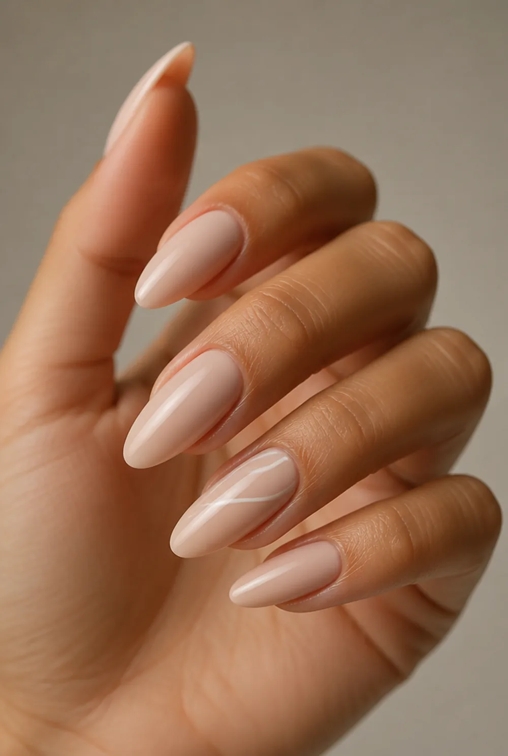 nude and white swirl nail art on olive skin, long length