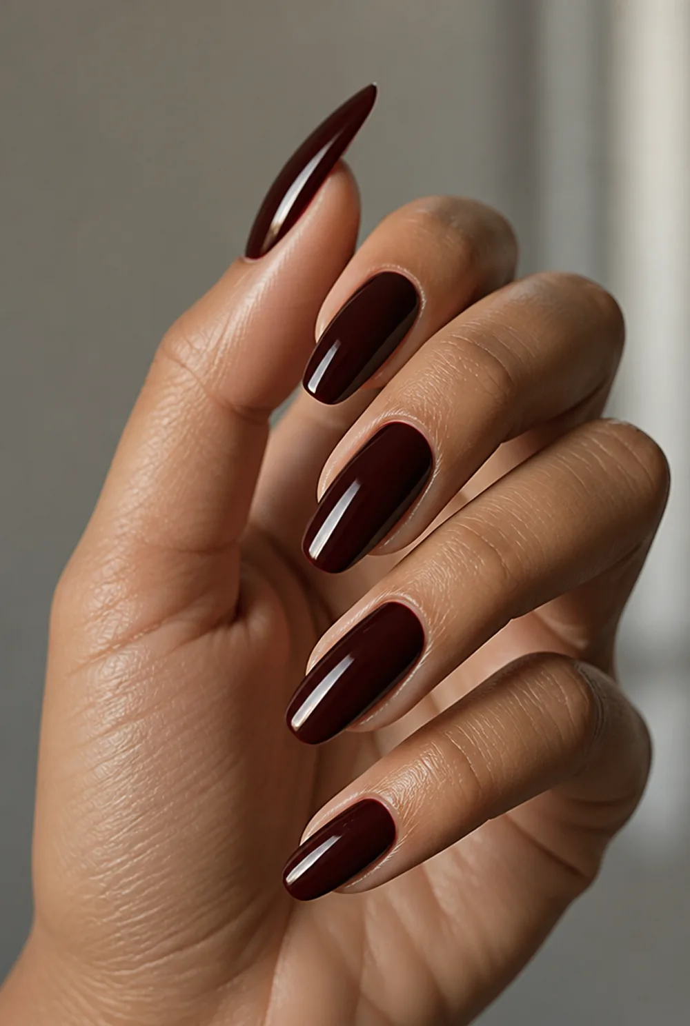 oxblood nail art on olive skin, long length