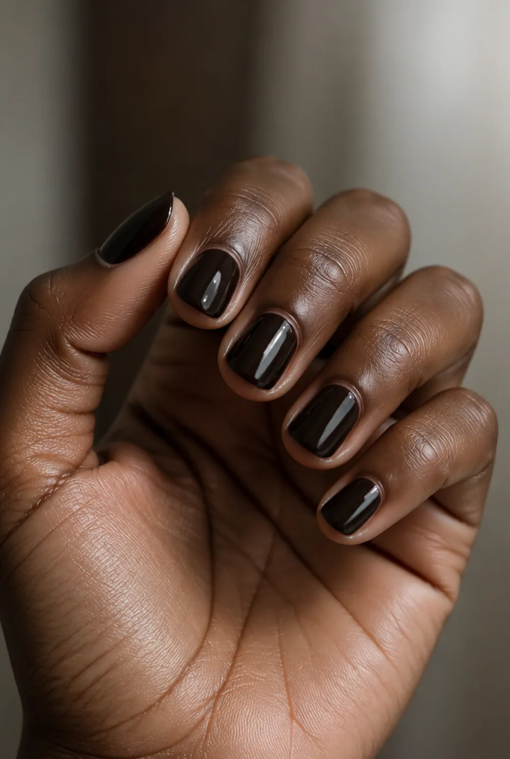 espresso nail art on deep brown skin