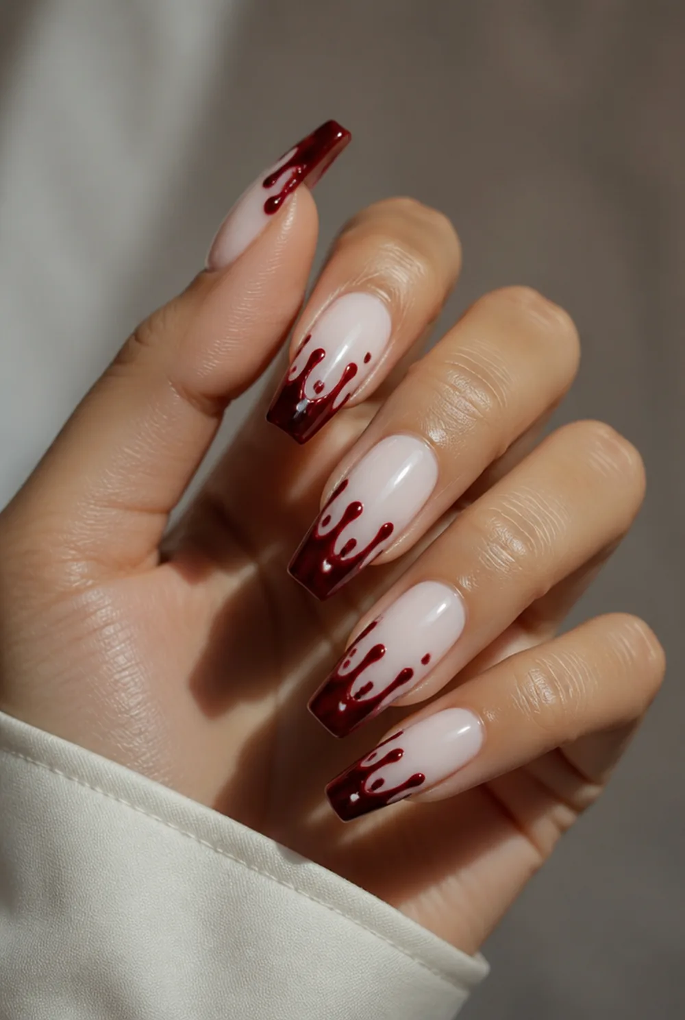 blood drip tips nail art on olive skin, long length