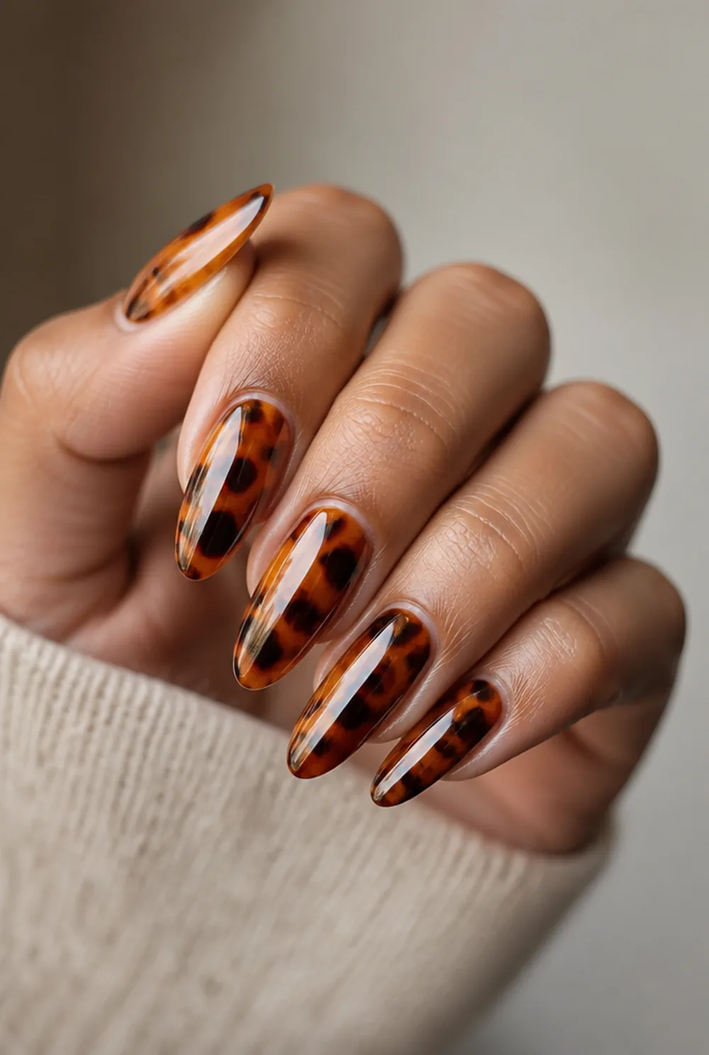 tortoiseshell nail art on olive skin, long length