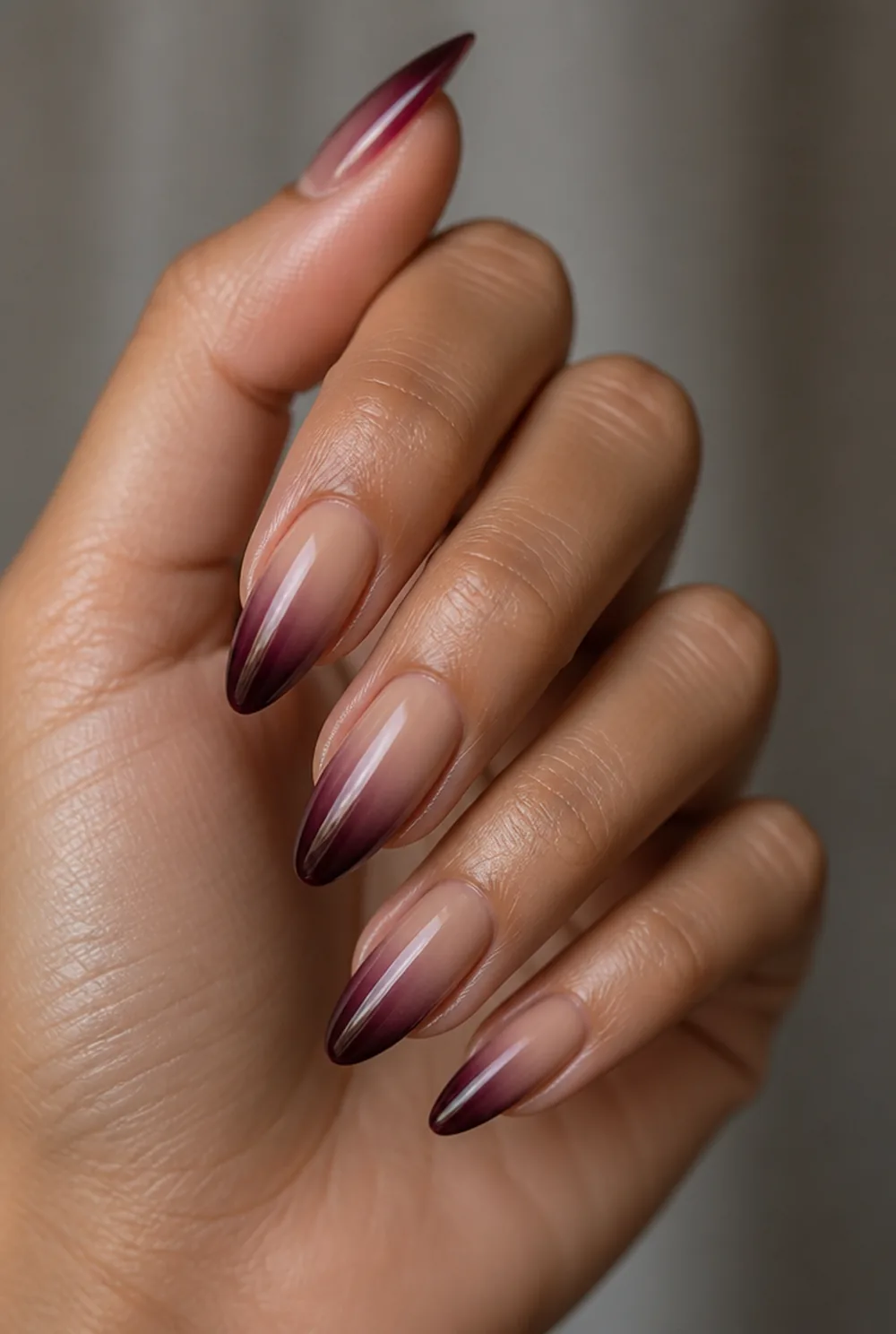 burgundy ombre nail art on olive skin, long length