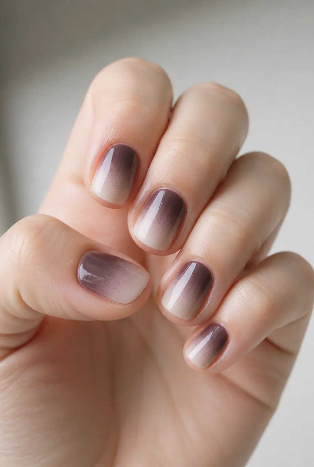 reverse ombre nail art on fair skin, short length