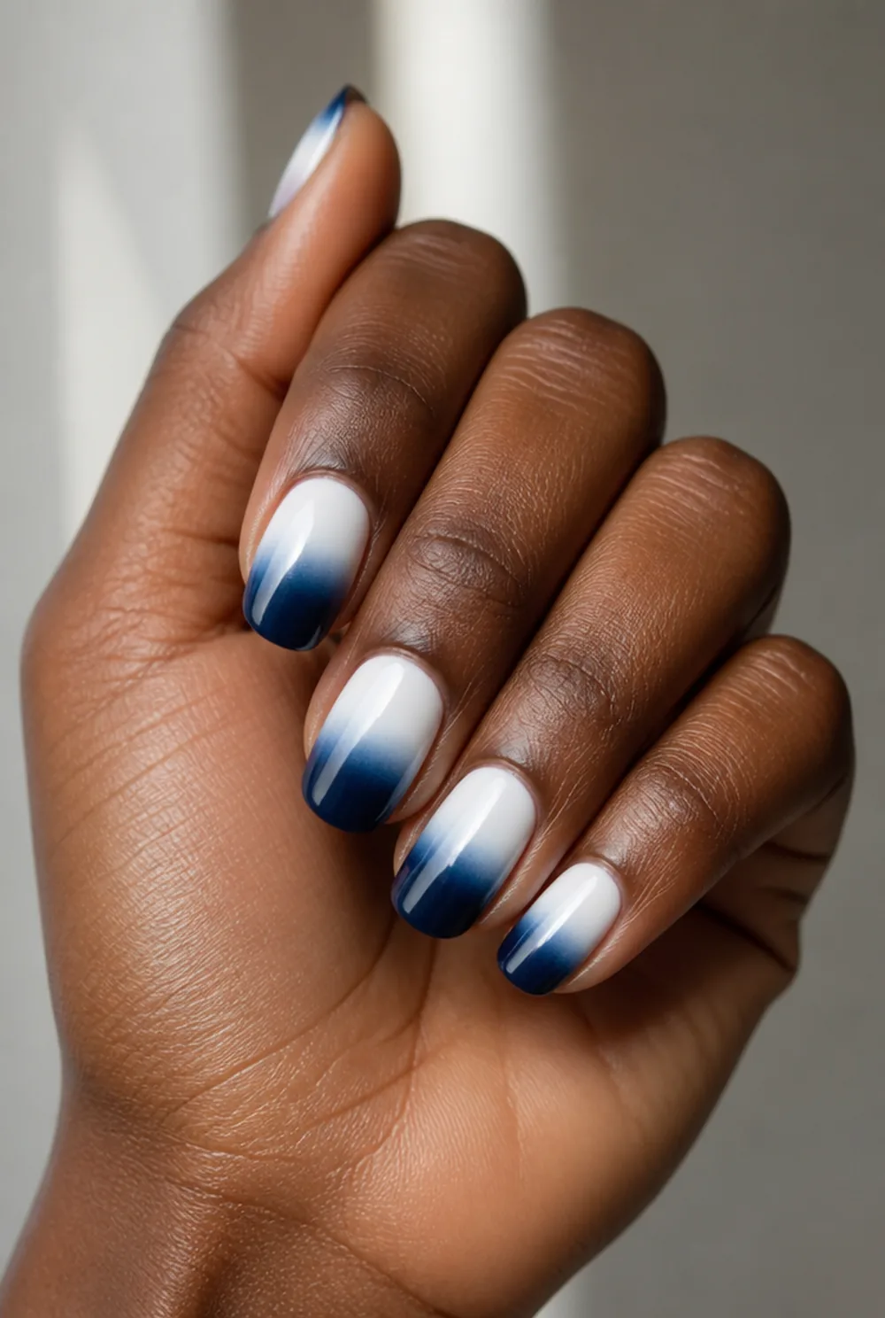 blue ombre nail art on deep brown skin