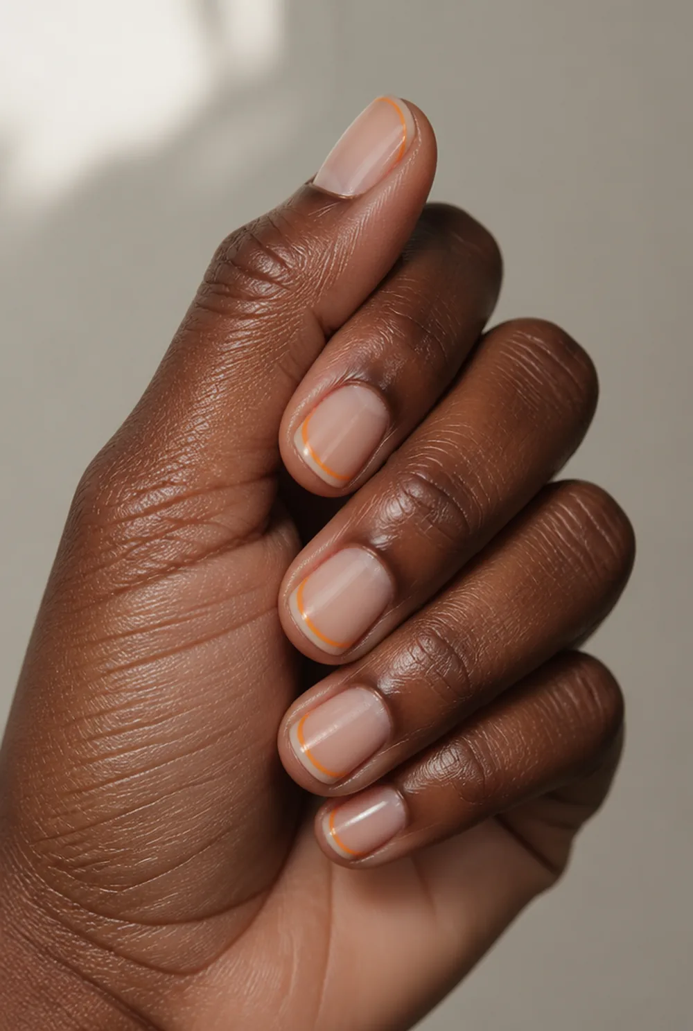 orange micro french nail art on deep brown skin - PolishedAndPrettyNails.com orange micro french nail art on deep brown skin
