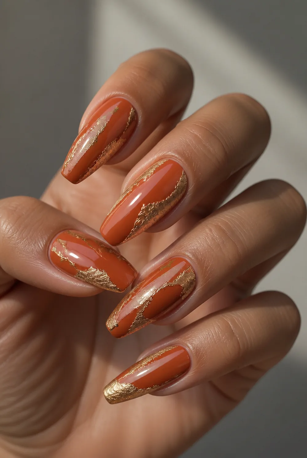 orange with gold foil nail art on olive skin long length - PolishedAndPrettyNails.com orange with gold foil nail art on olive skin, long length