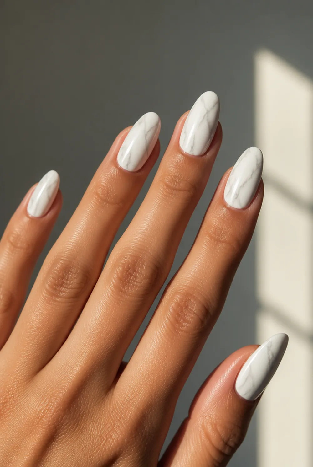 oval marble nail art on olive skin, long length