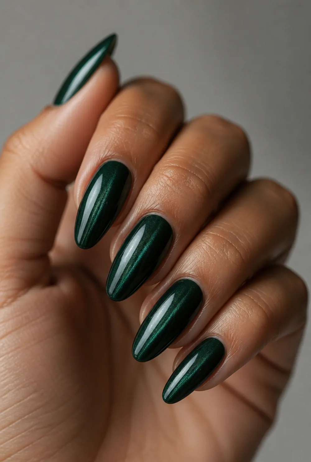 oval cat eye nail art on olive skin, long length