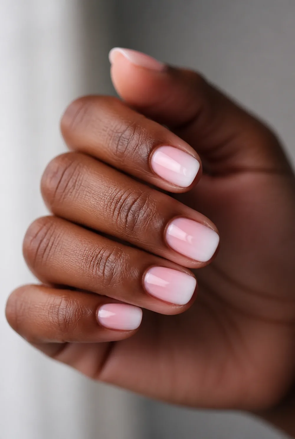 oval ombre nail art on deep brown skin