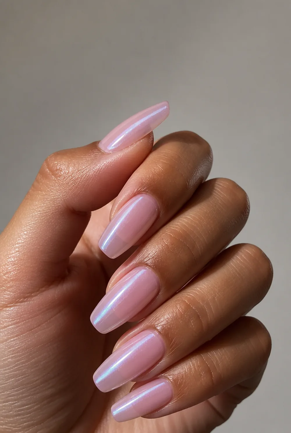 pink glazed donut nail art on olive skin, long length