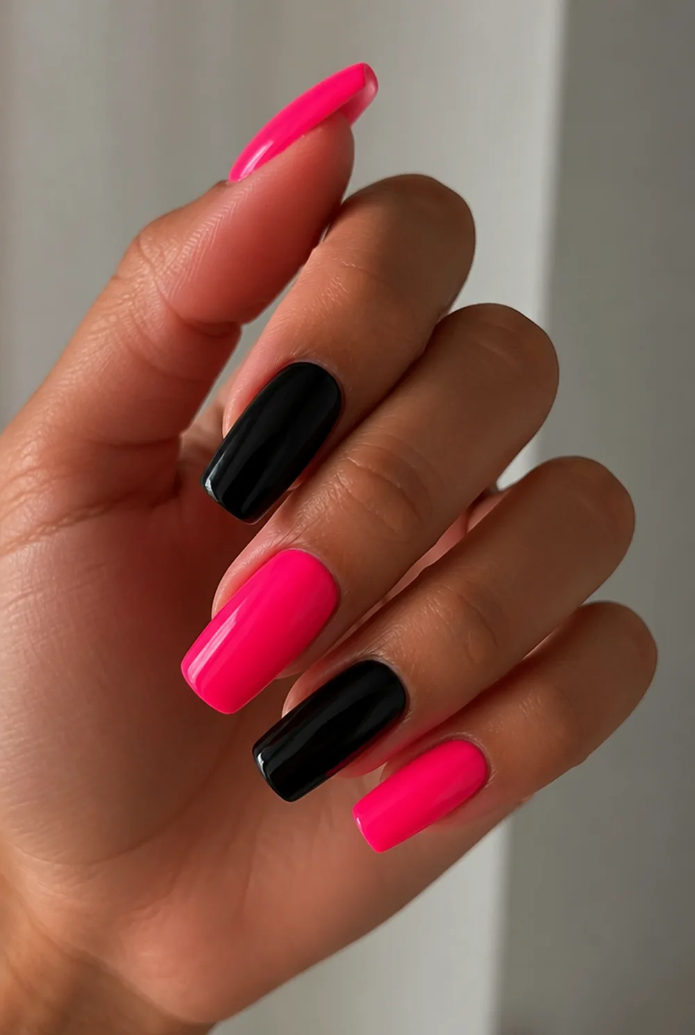 pink and black nail art on olive skin, long length