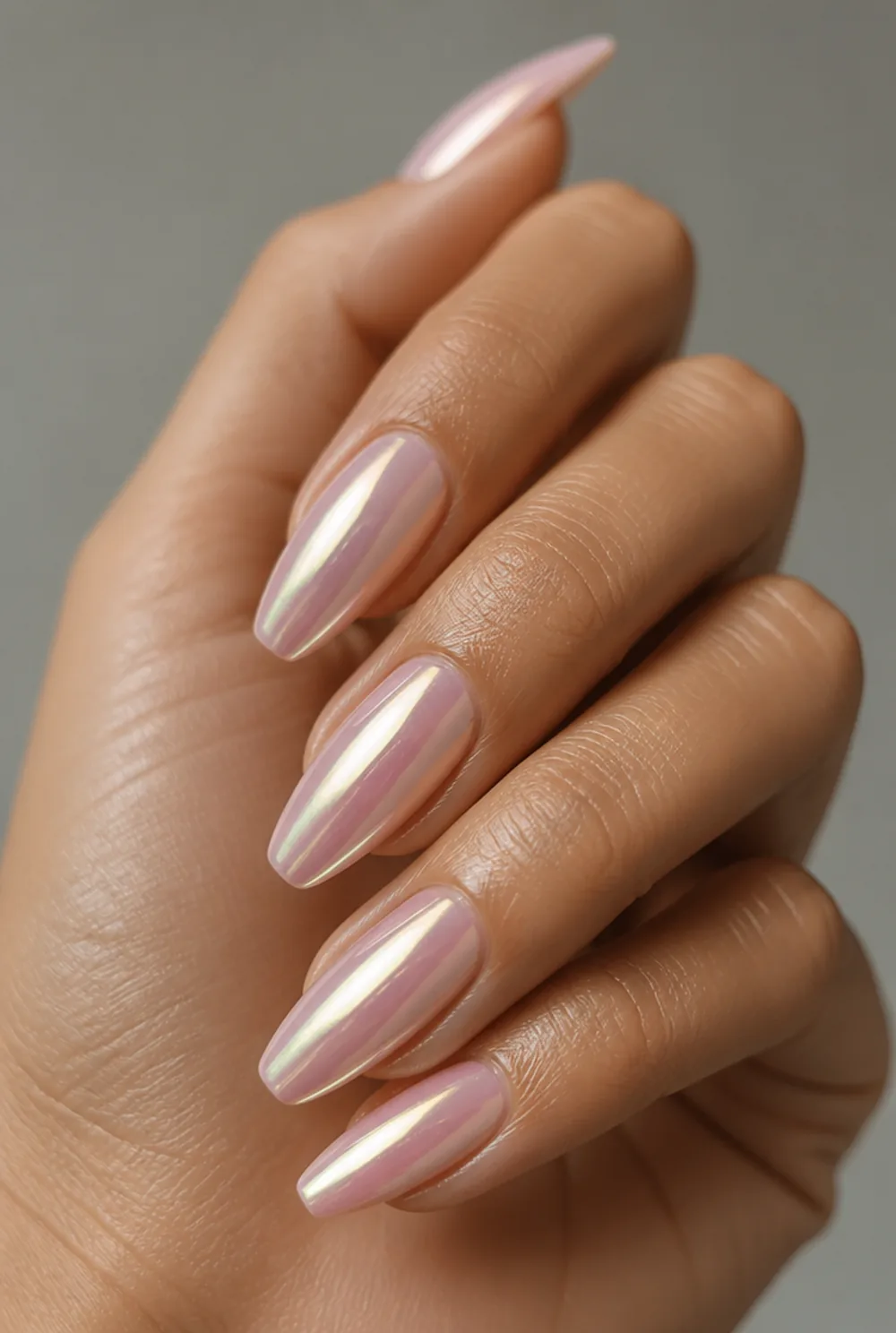 pink chrome nail art on olive skin, long length