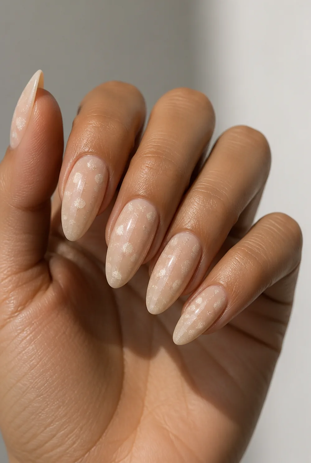 glitter dots nail art on olive skin, long length