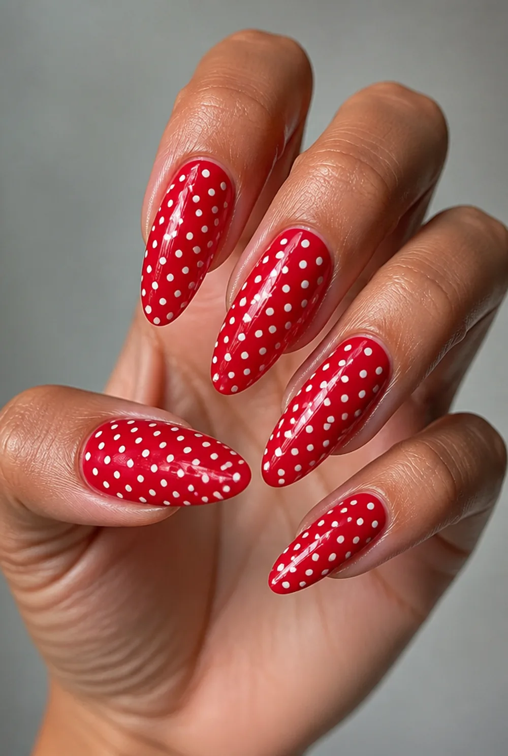 white on red nail art on olive skin, long length