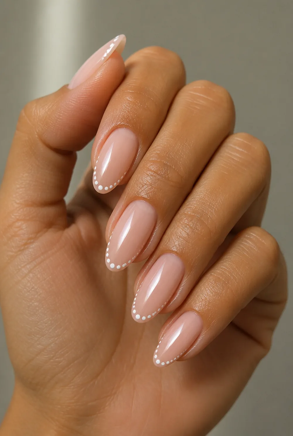 dotted french tip nail art on olive skin, long length