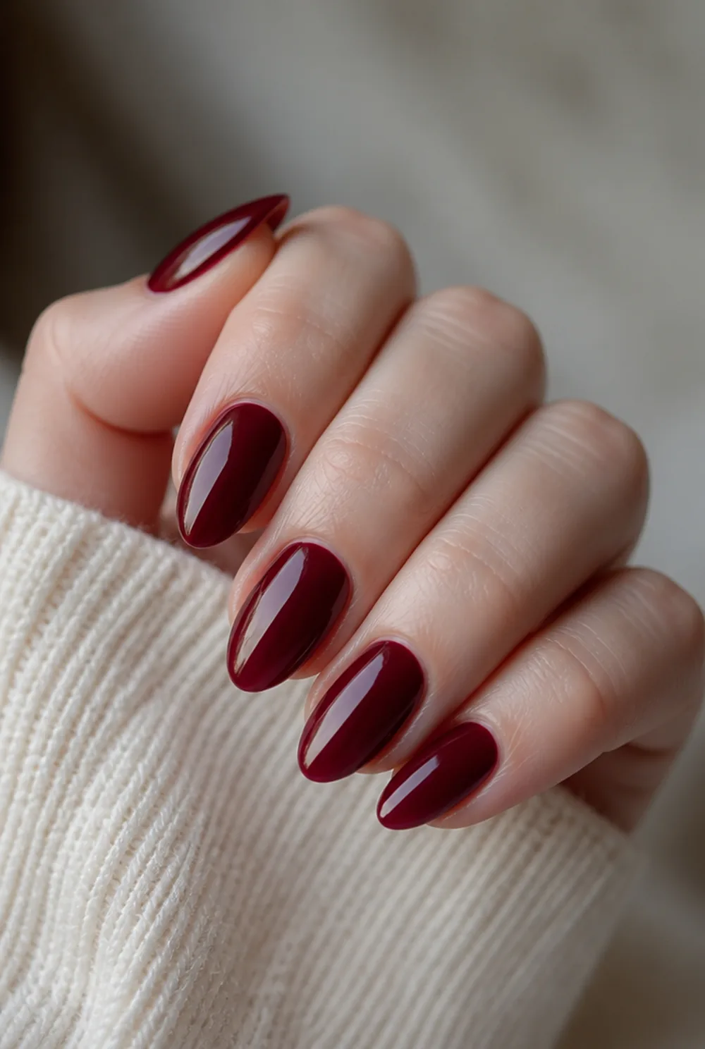merlot almond nail art on fair skin, short length