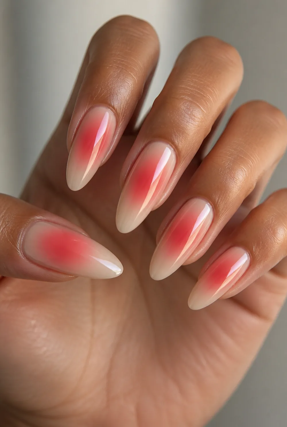 red aura nail art on olive skin, long length