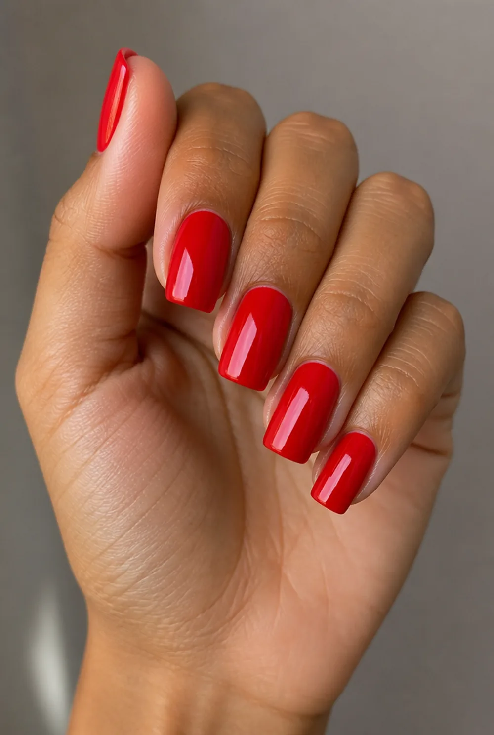 fire engine gloss nail art on olive skin, long length