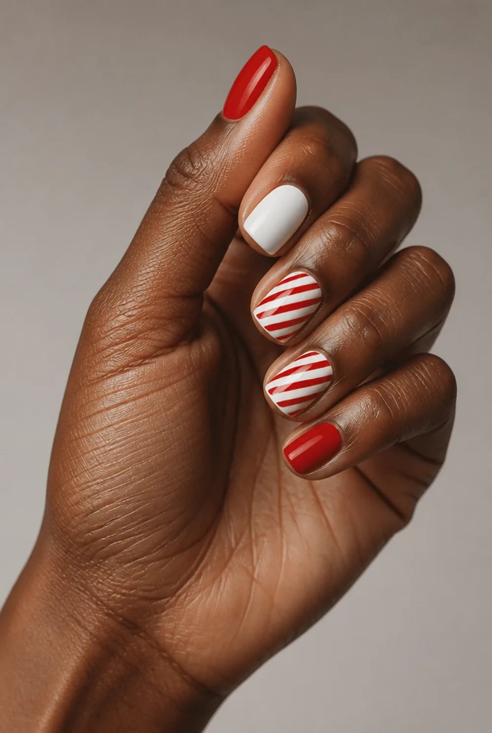 candy cane stripes nail art on deep brown skin