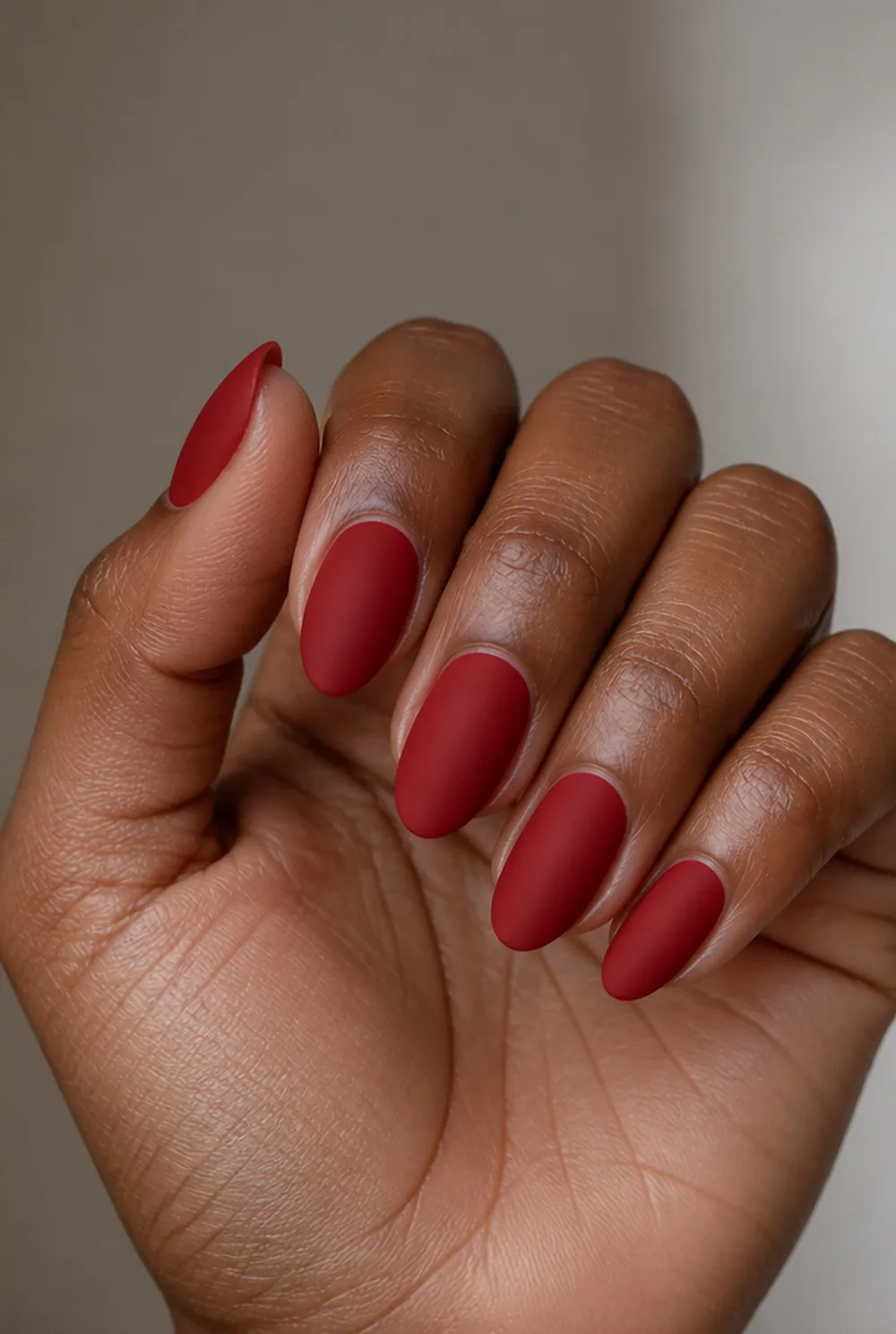velvet red matte nail art on deep brown skin